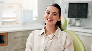 Happy dental patient in treatment chair
