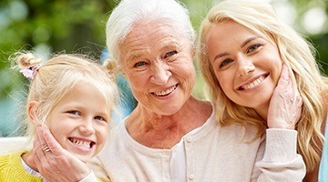 Grandmother mother and daughter smiling