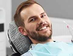 Smiling man in dental chair