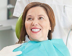 Smiling woman in dental chair