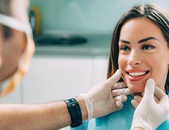 Dentist examining a patient’s smile