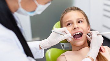 A child receiving a dental exam.