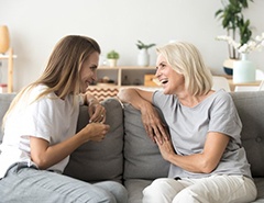 Ladies conversing on couch?