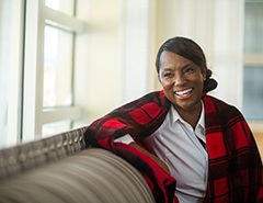 woman smiling after getting dental implants in Newark