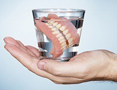 Full dentures in glass of water