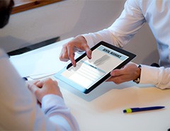 Patient reviewing dental insurance form on tablet