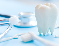 toothbrush, model tooth, and stethoscope for cosmetic dentistry in Newark