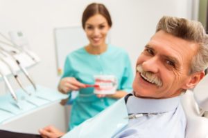 Man smiles after getting his new dental implants in Newark