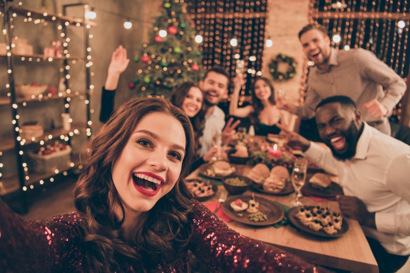 Group of friends smiling during festive dinner