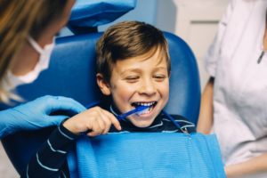 young boy seeing his family dentist in Newark 