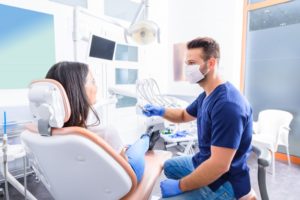 woman talking to dentist in Newark