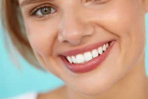 Woman with beautiful smile thanks to Newark cosmetic dentist