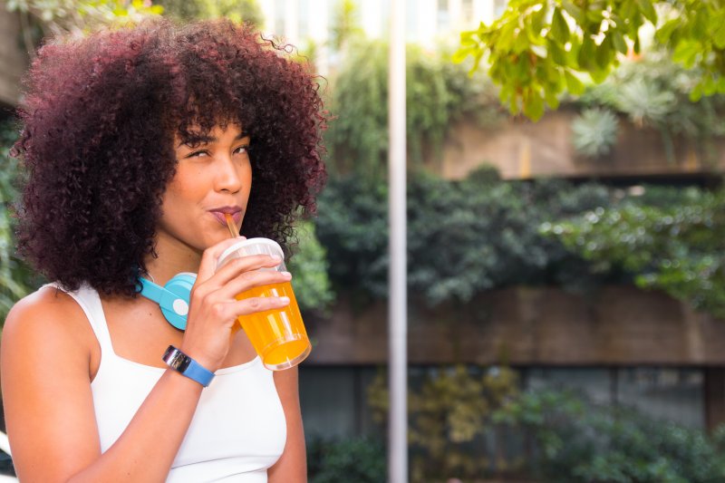 person drinking fresh juice