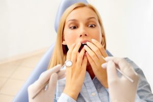 woman looking scared in dental chair