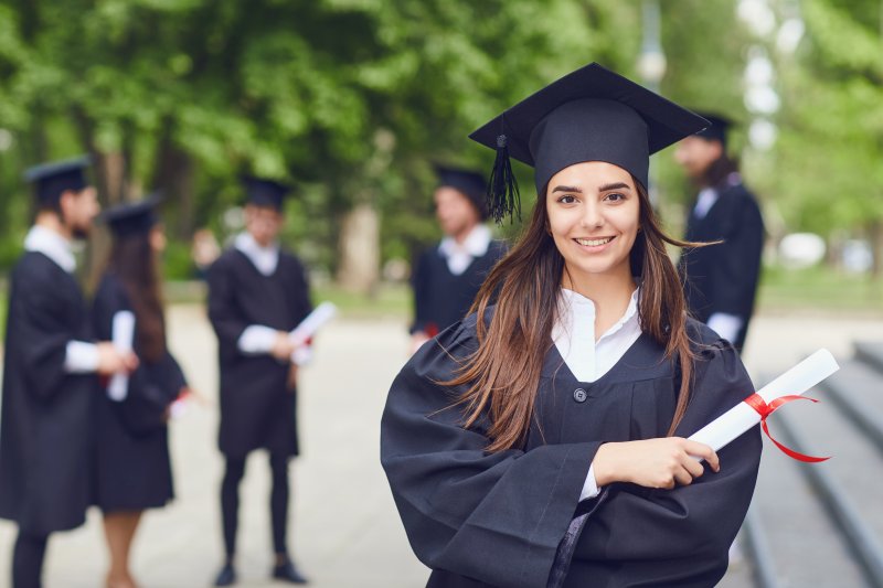 graduate smiling for the camera