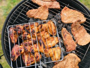 Grilled meat cooking on barbeque 