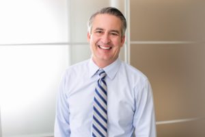 Smiling man in shirt and tie