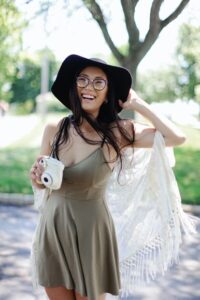 Smiling female tourist enjoying outdoors